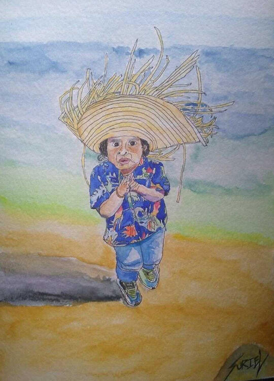 My nephew Kayden walking along a beach